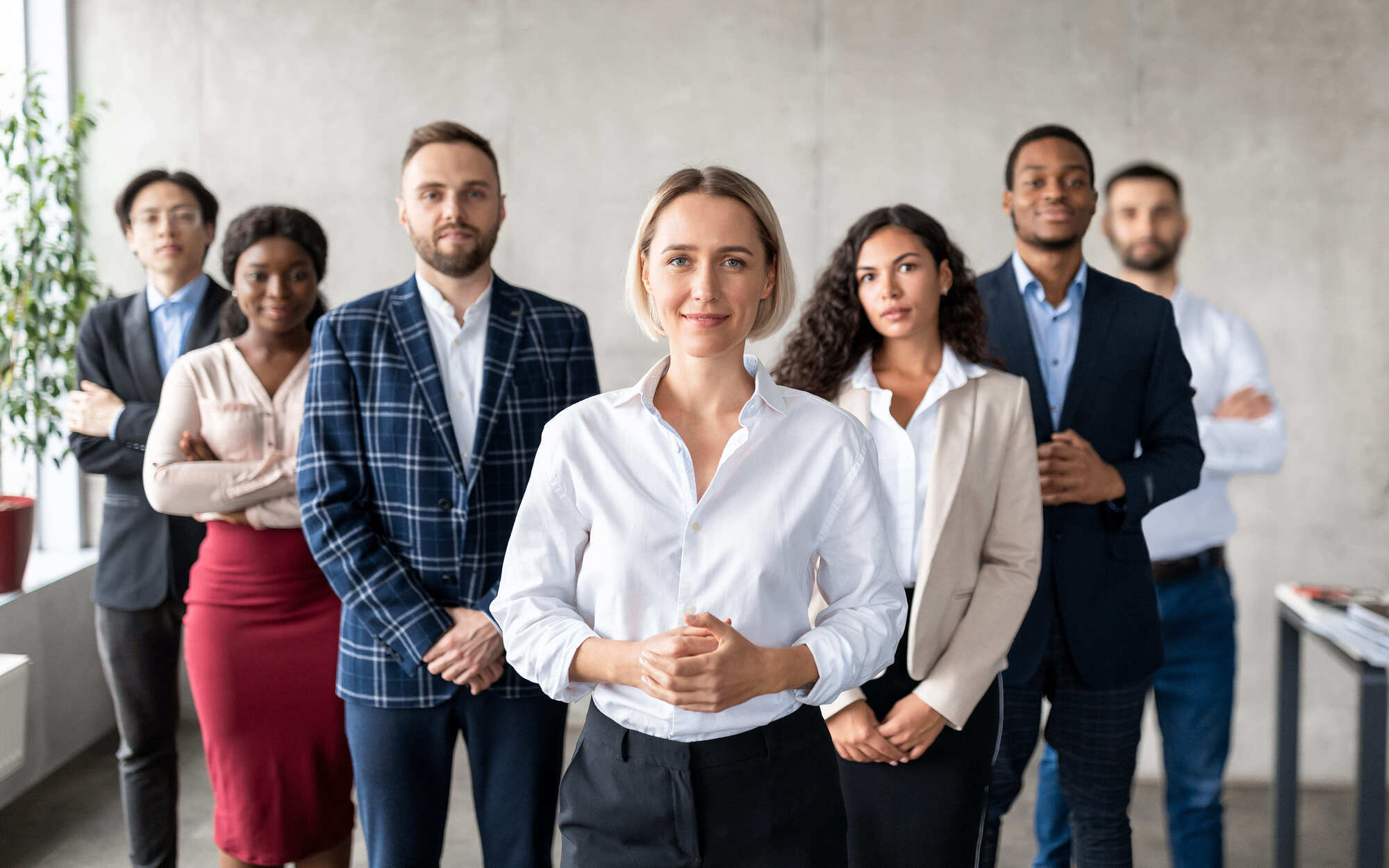 successful-businesswoman-standing-in-front-of-busi-2026-01-08-23-10-42-utc-1